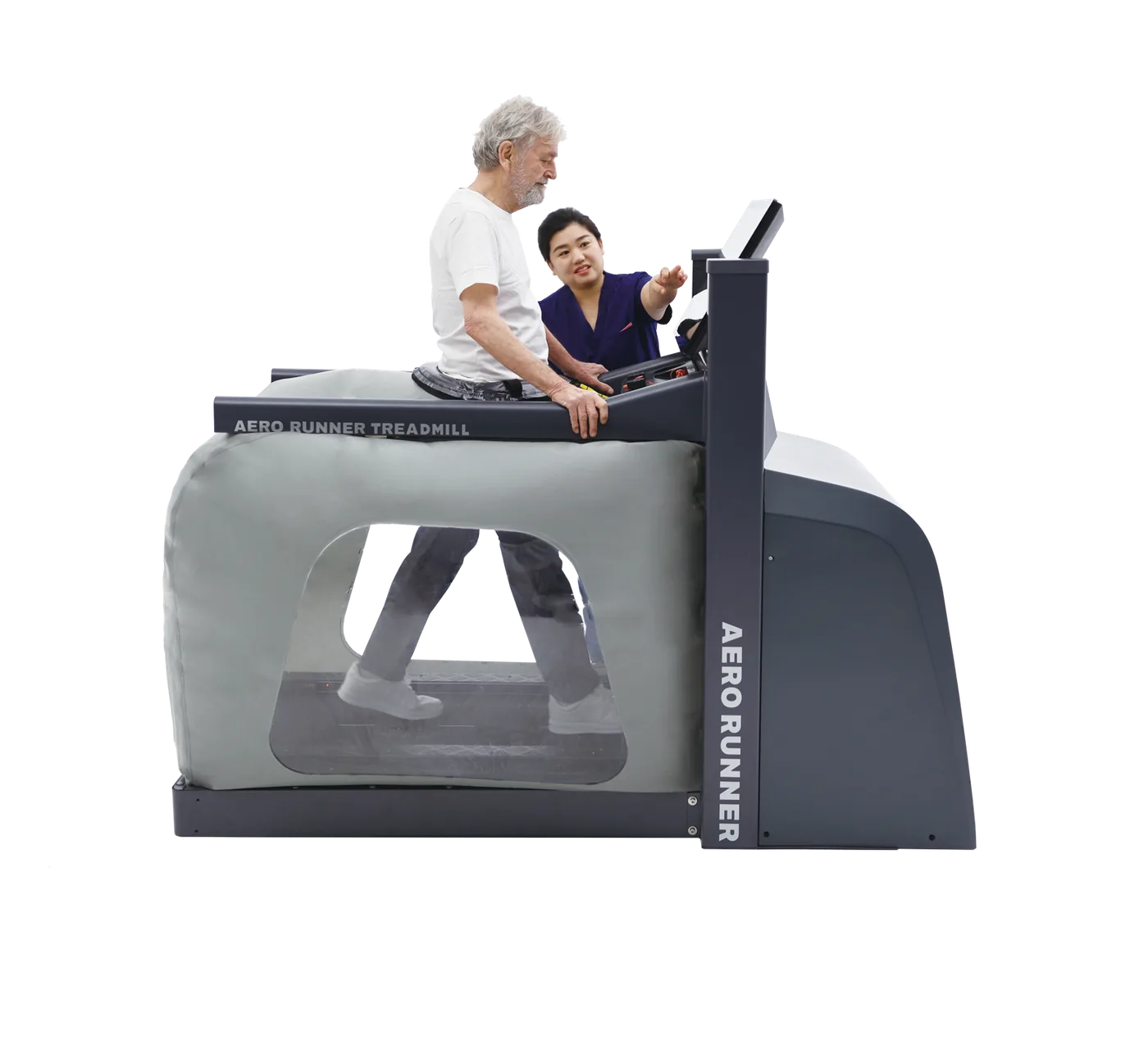 A clinician guides an older patient walking on the AERO RUNNER anti-gravity treadmill