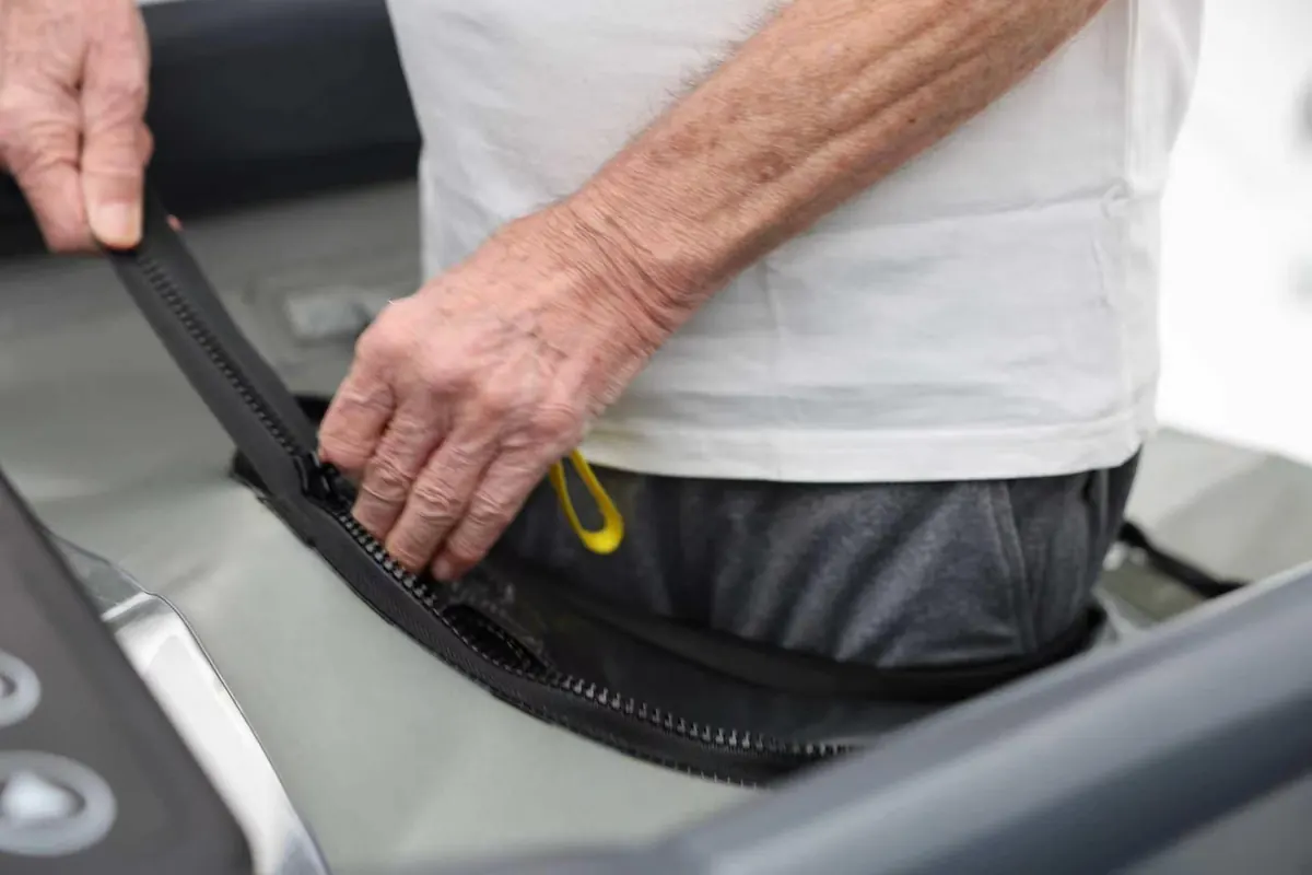 Close-up of the zip seal closing at the patient’s waist